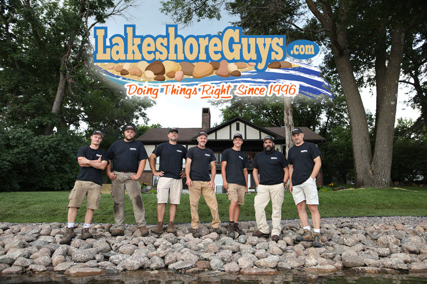 Lakeshore Guys team standing on shoreline