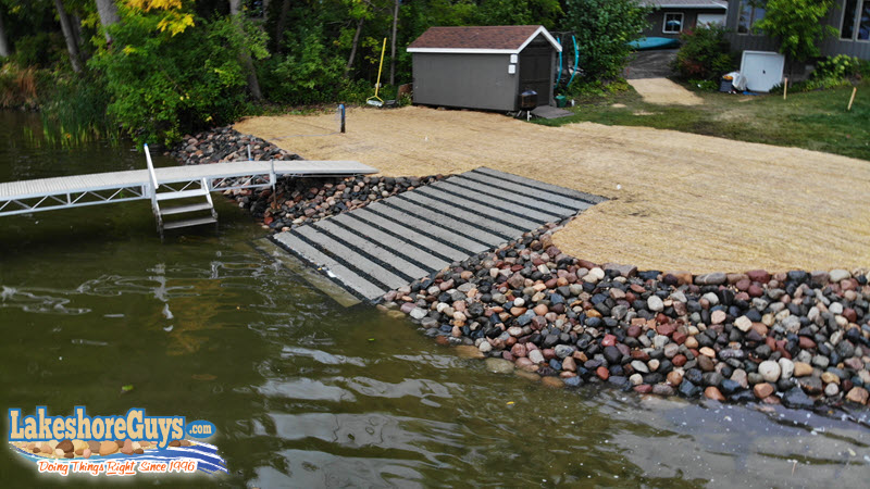 Segmented concrete boat ramp on riprap shoreline - aerial view