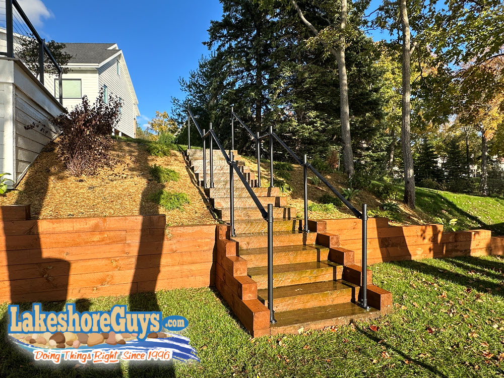 Timber staircase and timber retaining wall, built near shoreline
